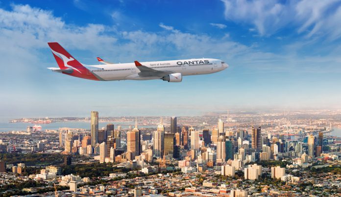 Qantas A330 over Melbourne's CBD